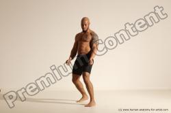 Underwear Gymnastic poses Man Black Muscular Bald Dancing Dynamic poses Academic